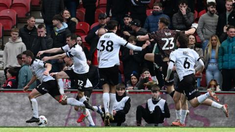 Bristol City players celebrate late equaliser at Middlesbrough