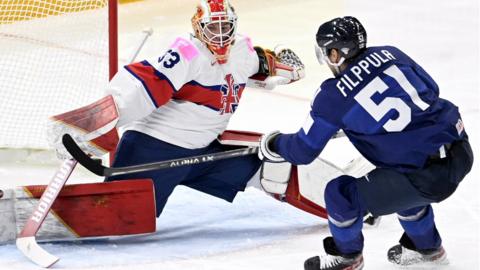 Britain's goalkeeper Ben Bowns makes a save against Finland's forward Valtteri Filppula