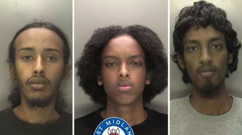 A composite of three police mugshots. The leftmost image shows a man with a short, untidy beard and tied back shoulder length hair. In the centre is a clean shaven man with curly, chin length hair. The right image is of a man with short, wavy black hair and a short beard