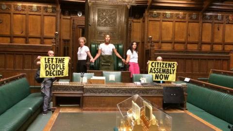 Some of the group of Extinction Rebellion protesters in the chamber