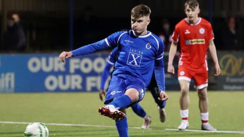 Adam Glenny scores penalty
