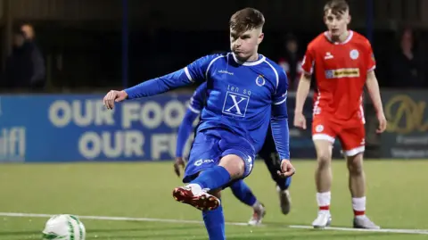 Adam Glenny scores penalty