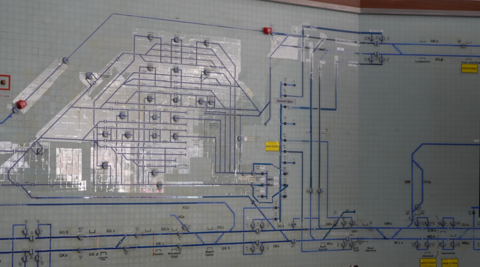 The original display which is now being decommissioned. It has a series of grids with blue lines that indicate where the tracks and junctions are located. It has since been switched off.