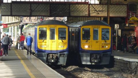 Two trains at platforms at Preston Railway Station