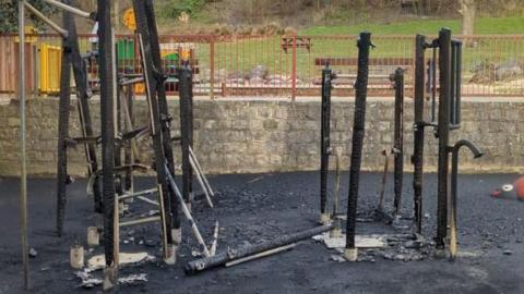 Play equipment at a park damaged by fire.