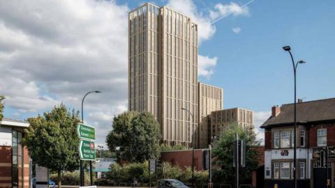 A CGI image depicting what the flats would look like against the Sheffield skyline. The flats appear in a tall beige-looking tower block. What appears to be a pub sits to the right of the picture, while a roadsign is in the foreground to the left.