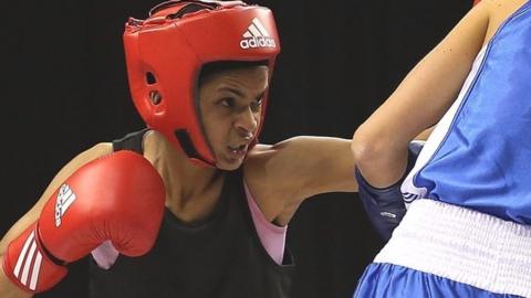 Ramla Ali throws a punch in the ring