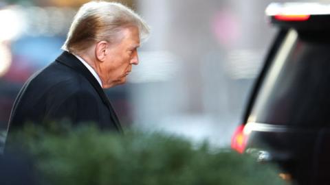 Former US President Donald Trump leaves Trump Tower for Manhattan federal court for the second defamation trial against him, in New York City on January 22, 2024. Writer E. Jean Carroll is seeking more than $10 million in damages in the civil trial, alleging that Trump defamed her in 2019 when he was president and she had just come out with her allegation, saying she "is not my type." This is separate to a civil case last year where another New York jury found Trump liable for sexually assaulting Carroll in a department store dressing room in 1996 and subsequently defaming her in 2022, when he called her a "complete con job." (Photo by Charly TRIBALLEAU / AFP) (Photo by CHARLY TRIBALLEAU/AFP via Getty Images)