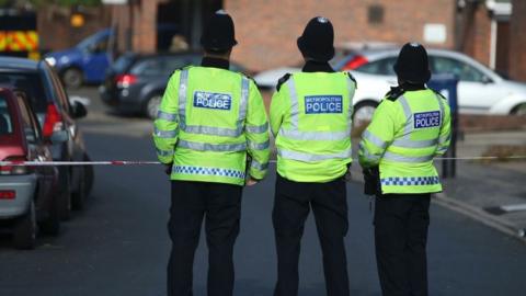 Police standing in front of a police corden