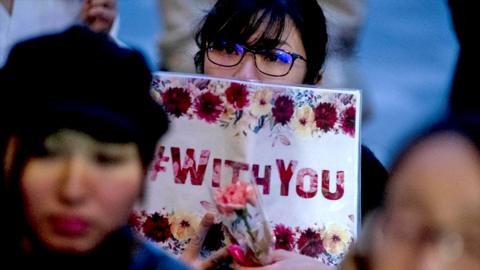 Protesters gather at the rally called 'Flower Demo' to criticize recent acquittals in court cases of alleged rape in Japan and call for revision of the anti-sex crime law, in front of Tokyo Station, Japan, on 11 June 2019