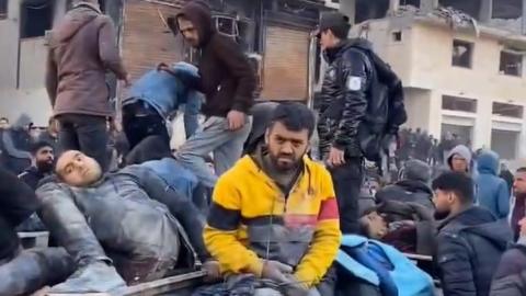 Screengrab of video posted online reportedly showing casualties on a lorry ear Nabulsi roundabout on Rashid Street, south-west of Gaza City (29 February 2024)