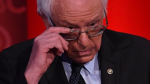 Bernie Sanders looking over the top of his glasses