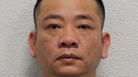 Custody image of Hai Nguyen in front of a white wall, with a serious expression and cropped close to his face