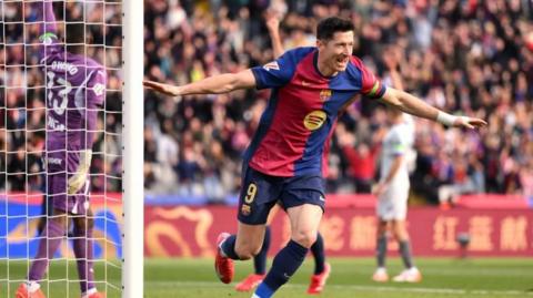 Barcelona's Robert Lewandowski celebrates scoring against Alaves in La Liga