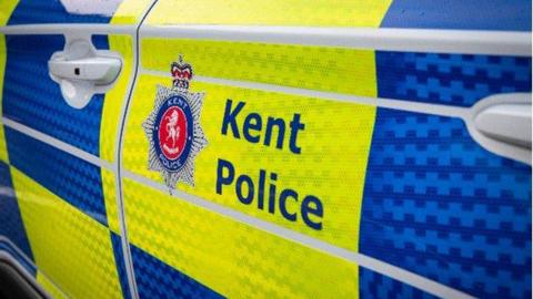 Kent Police log on the side of a police car