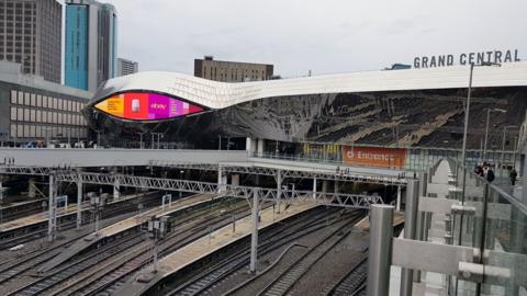 Birmingham New Street railway station viewed from the air above the tracks leading into the station, 