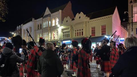 The procession made its way down the High Street towards the Town Hall