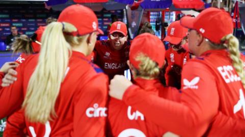 Heather Knight talks to her England team-mates