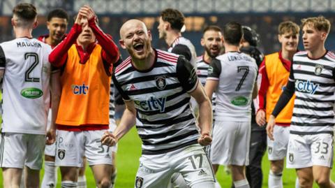 Queen's Park players celebrate