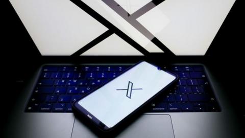 X logo on a phone and laptop