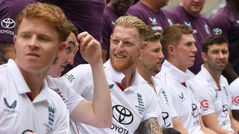 Ben Stokes, Joe Root, Harry Brook, Ollie Pope, Zak Crawley and Mark Wood chat during an England team photo