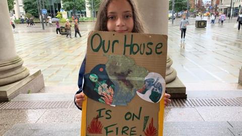 Lillia at a climate change protest march in Manchester