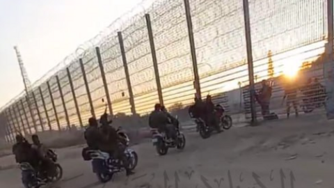 A line of militants on motorbikes