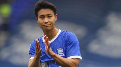 Paik Seung-ho claps the crowd after a game for Birmingham City