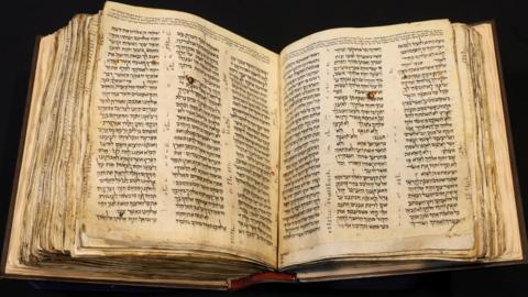 The Codex Sassoon, the oldest most complete Hebrew Bible, on display at Sotheby's in New York (15 February 2023)