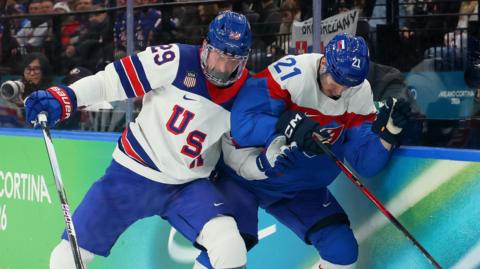  Brock Nelson #29 of Team United States and Adam Ruzicka #21 of Team Slovakia play the puck in the second period during the Men's Semifinals Playoff match between the United States and Slovakia on day fourteen of the Milano Cortina 2026 Winter Olympic games at Milano Santagiulia Ice Hockey Arena