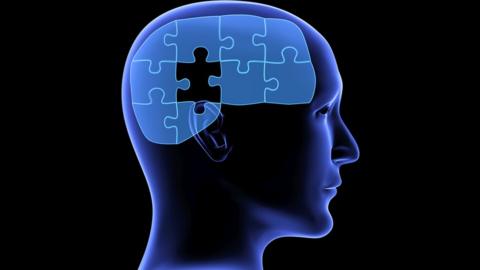 Illustration of a head in profile with a puzzle in the place of brain and there is one piece missing.