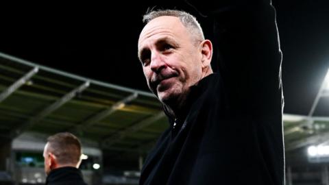 John Cartwright looking up to the stand waving after his final game in charge of Hull