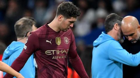 John Stones is substituted off early in Manchester City's Champions League match against Real Madrid