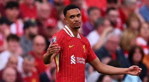 Liverpool player Trent Alexander-Arnold looks frustrated and throws his hands up