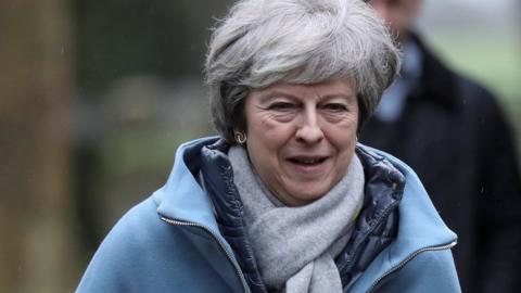 Prime Minister Theresa May leaves a church near High Wycombe on Sunday