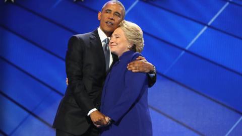 Clinton and Obama, hugging