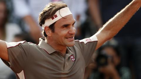 Roger Federer celebrates beating Stan Wawrinka in the French Open quarter-finals