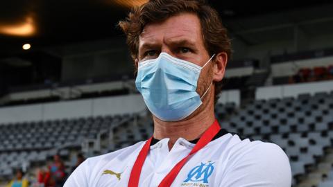 Marseille manager Andre Villas-Boas wearing a face covering on the touchline during a friendly against Nimes