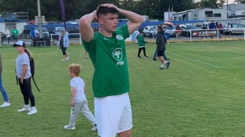 Dejected Guernsey footballer