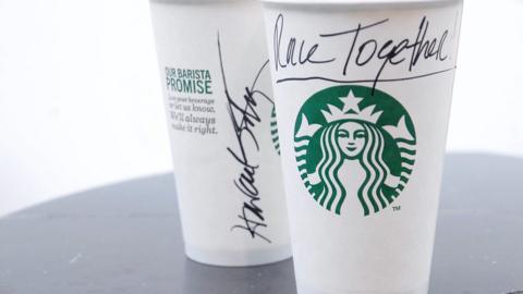 Starbucks cup with "Race Together" written on it