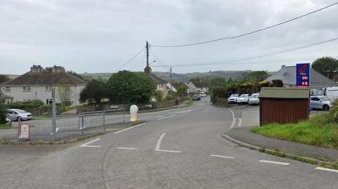 Google Street View image of a road junction in Hatt. A petrol station is on the right-hand side.