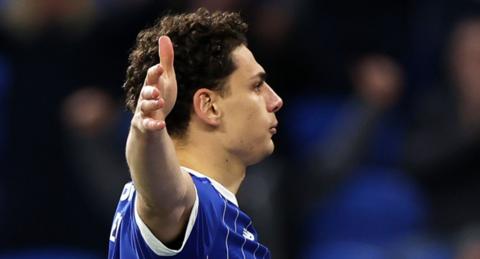 Yousef Salech side on with arm outstretched to his side