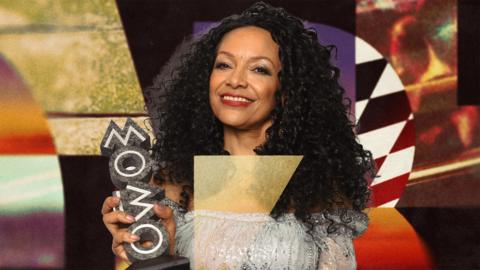 Kanya King holds a MOBO award