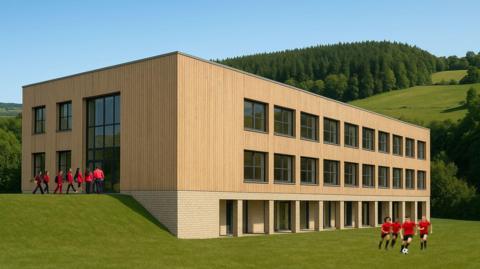 An artist's impression of how a new school building will look. It is an angular, wooden-clad building which sits on two levels across a hillside, with rows of square windows and trees and hills in the background. There are children outside wearing red and black uniforms.