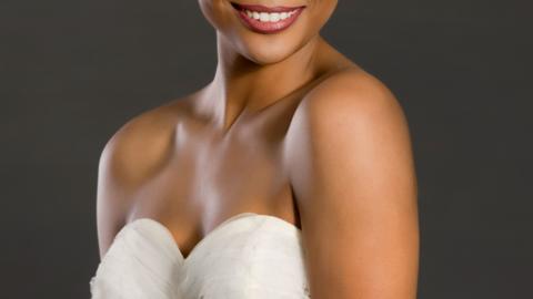 A model poses in a white wedding dress. Stock photo from archive.