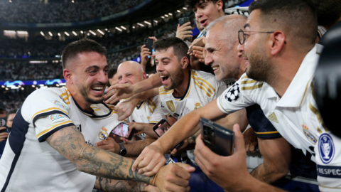 Joselu celebrates with the Real Madrid fans