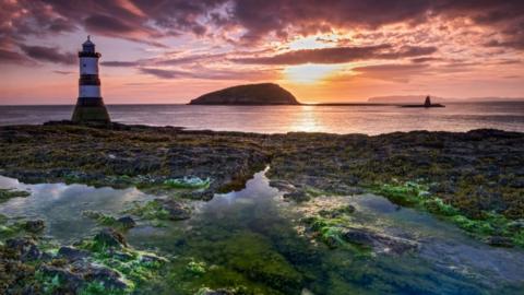 Sunrise over Puffin Island and Trwyn Du Lighthouse on Anglesey