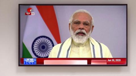 Narendra Modi giving a speech on TV