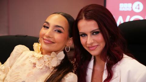 Two women sitting next to each other smiling at the camera in the Woman’s Hour studio.