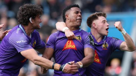 Exeter players celebrate a try